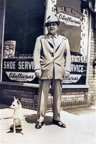 Michele Zullo standing before his shoe shop